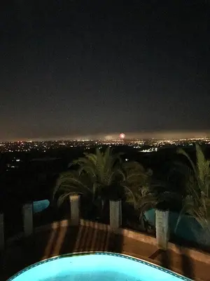 a view of the city at night from a swimming pool at Private Bedroom & Bathroom Grove, Pool & City View in Oceanside
