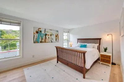 a bedroom with a large bed and a window at Ocean Harbor View Dana Point in Dana Point
