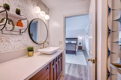 a bathroom with a sink and a mirror at Ocean Harbor View Dana Point in Dana Point
