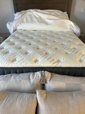 an unmade bed in a bedroom with two pillows at Stunning Ocean Beach Gem - has everything! in San Diego