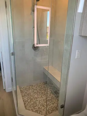 a shower with a glass door and a window at Stunning Ocean Beach Gem - has everything! in San Diego