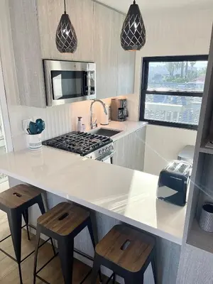 a kitchen with a counter and a stove top oven at Stunning Ocean Beach Gem - has everything! in San Diego