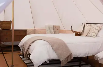 a bedroom with a bed and a chair at Natures Nest in Poway