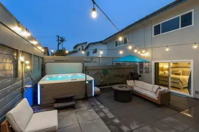a patio with a jacuzzi tub on a building at Beachfront Home In Carlsbad - Remodeled in Carlsbad