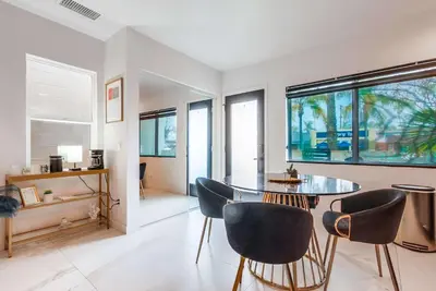 a dining room with a glass table and chairs at 3 blocks to ocean luxury patio nightlife in San Diego