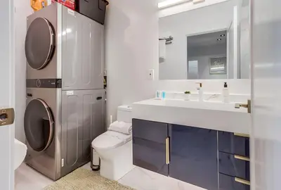 a bathroom with a toilet and a sink at 3 blocks to ocean luxury patio nightlife in San Diego