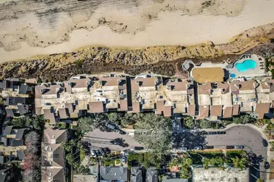 an aerial view of houses on the beach at SurfSong Dream - Beachfront in Solana Beach