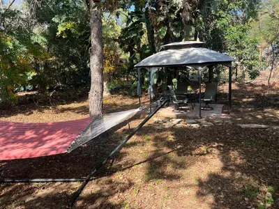a hammock in a park with a gazebo at The Grove Studio at Mt Helix in La Mesa