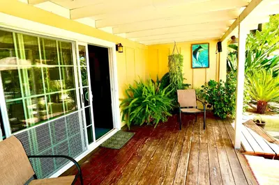 a porch of a house with a wooden deck at La Casita Poolside Retreat in Lake Elsinore