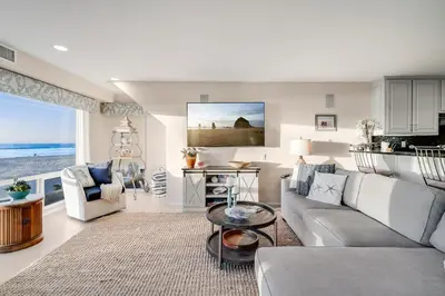 a living room with a couch and a table at Navigate Stays Front Row to Paradise in San Diego