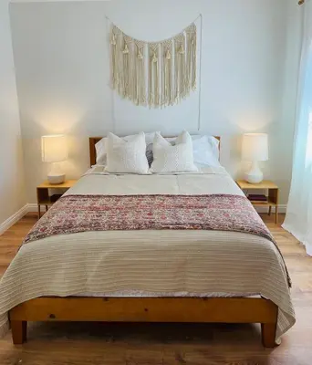 a bedroom with a large bed with two lamps at 4Bd Spacious Oasis near wineries in Menifee