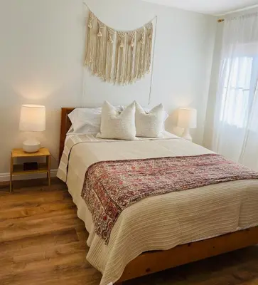 a bedroom with a large bed with two lamps at 4Bd Spacious Oasis near wineries in Menifee