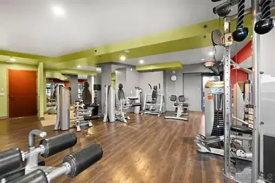 a gym with a lot of equipment in a room at Luxurious and Spacious 2-Bedroom Condo Unit Downtown San Diego in the Heart of the Gaslamp Quarter - 14-Day Min in San Diego