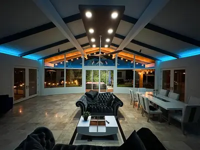 a living room with couches and a dining room at Hilltop Villa & Guesthouse, Pool Oasis, Pickleball Court in Fallbrook