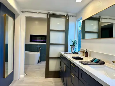a bathroom with a tub and a sink and a bath room at Hilltop Villa & Guesthouse, Pool Oasis, Pickleball Court in Fallbrook