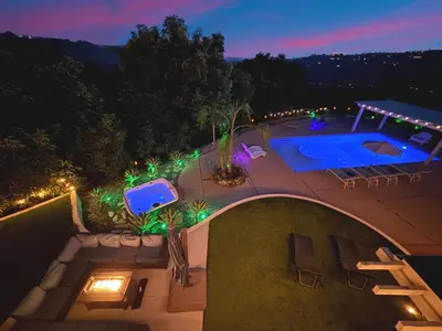 an overhead view of a swimming pool at night at Hilltop Villa & Guesthouse, Pool Oasis, Pickleball Court in Fallbrook