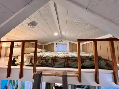 a bedroom with two bunk beds in a room at Tiny House on private large property in Vista