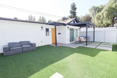 a backyard with a couch and a patio at Exotic home Rogers road in Spring Valley