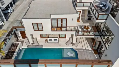 an aerial view of a house with a swimming pool at Brand New Listing Elegant 7BR Masterpiece Walk to Beach Shops & Dining in San Diego