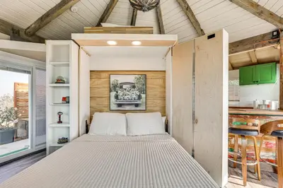 a bed in the middle of a room at Backyard and Zen Garden Hilltop Haven in Bonsall! in Vista