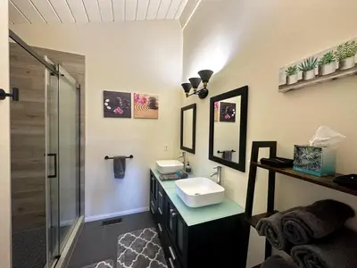 a bathroom with a sink and a shower at Hilltop Penthouse Cottage with Sweeping Views in Fallbrook
