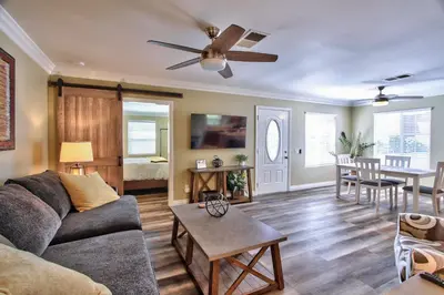a living room with a couch and a table at Hutchison Estate, Guest Suite 1 in Murrieta
