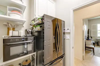 a kitchen with a stainless steel refrigerator at Private and Spacious Deluxe Rolling Hills Ranch Gem in Chula Vista
