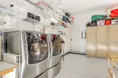 a kitchen with two washer and dryer at Private and Spacious Deluxe Rolling Hills Ranch Gem in Chula Vista