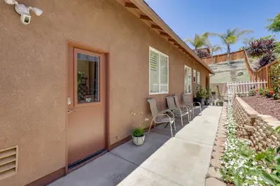 a patio with chairs and a door on a house at Private and Spacious Deluxe Rolling Hills Ranch Gem in Chula Vista
