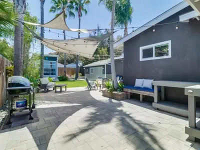 a patio with a bench and a house at Bay Park Gem - Fully Loaded in San Diego