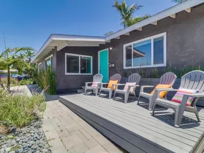 a group of chairs sitting on a wooden deck at Bay Park Gem - Fully Loaded in San Diego