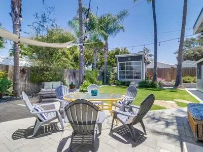 a patio with chairs and a table and a table and chairs at Bay Park Gem - Fully Loaded in San Diego