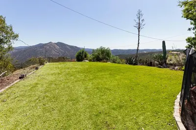 a large grassy hill with mountains in the background at San Diego Getaway, Views Pool Hot Tub & Game Room in Valley Center