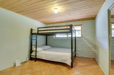 a bedroom with bunk beds in a room with a ceiling at 4 Mi to Lake Wohlford Cabin in Escondido in Valley Center