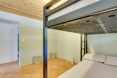 a bed in a room with a wooden ceiling at 4 Mi to Lake Wohlford Cabin in Escondido in Valley Center