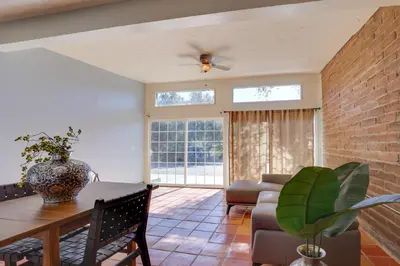 a living room with a dining table and a couch at 5 Mi to Casino and Lake Home on Escondido Ranch! in Valley Center