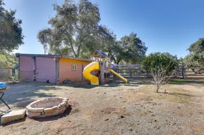 a playground with a slide and a play structure at 5 Mi to Casino and Lake Home on Escondido Ranch! in Valley Center