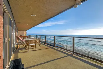 a balcony with a view of the ocean at Oceanfront Getaway - Ocean Views - Fire Pit - BBQ - Beach Access in Carlsbad