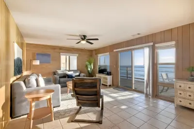 a living room with a view of the ocean at Oceanfront Getaway - Ocean Views - Fire Pit - BBQ - Beach Access in Carlsbad