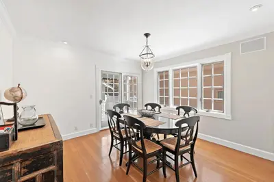 a dining room with a table and chairs at Luxurious Seaside Escape-85 Steps to the Beach-Panoramic Ocean Views in Laguna Beach