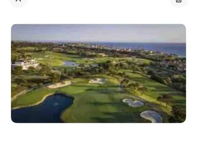 an aerial view of a golf course with the ocean at Ritz Pointe dr in Dana Point