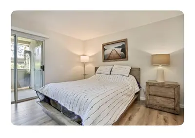 a bedroom with a large bed and a window at Ritz Pointe dr in Dana Point