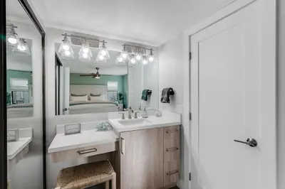 a bathroom with two sinks and a large mirror at Luxury Meets Coastal Charm in North Mission Beach in San Diego