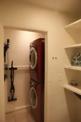 a washer and dryer in a laundry room at Modern Retro Close to DT, Zoo, Parking, Hot Tub in San Diego