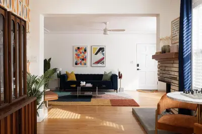 a living room with a couch and a table at Modern Retro Close to DT, Zoo, Parking, Hot Tub in San Diego