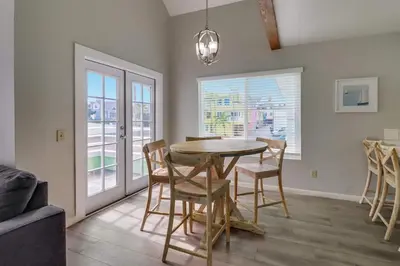 a dining room with a table and chairs at Steps to bay & ocean Belmont Park dining in San Diego