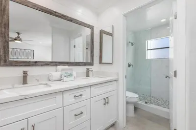 a white bathroom with a sink and a toilet at Trackside Tranquility - TC522B in Solana Beach