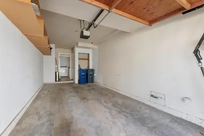 an empty room with white walls and wood ceilings at Trackside Tranquility - TC522B in Solana Beach