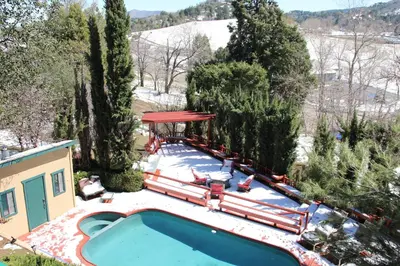 an overhead view of a swimming pool in the snow at Eaglenest Inn with Pool & Seasonal SPA in Julian