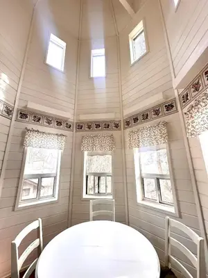 a dining room with a white table and two chairs at Eaglenest Inn with Pool & Seasonal SPA in Julian